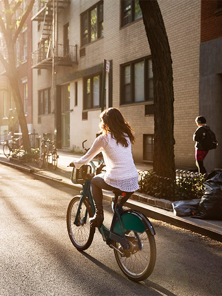Girl riding her bicycle in the residential street