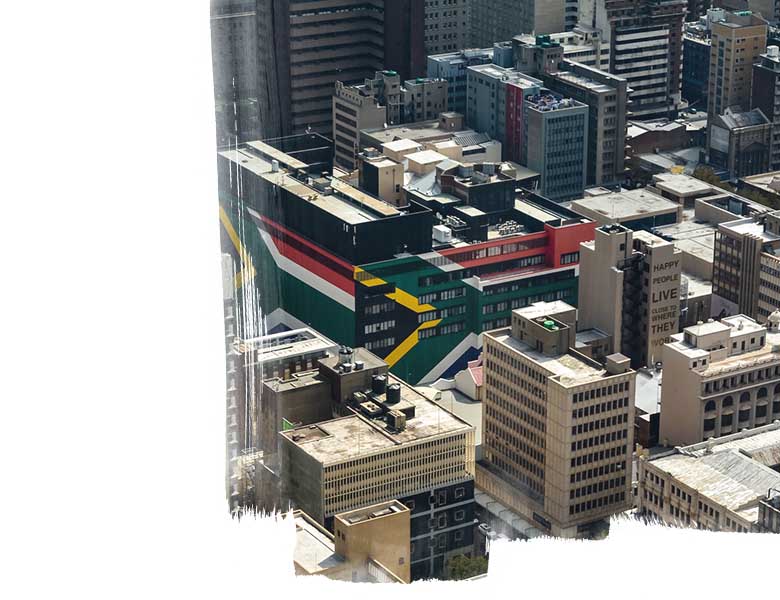 A view of Johannesburg inner city with flag on the buildings